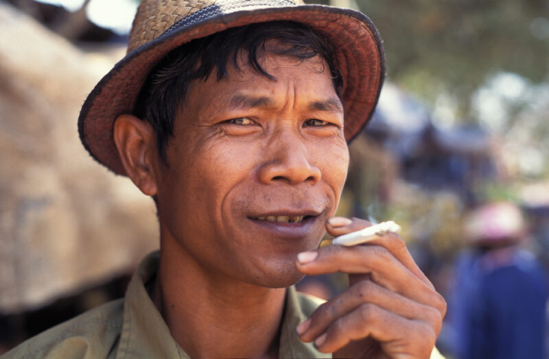 Smoking Man in Cambodia — Stock Image of man smoking cigarette in Cambodia — smoking, cigarette, health, Cambodia, tobacco