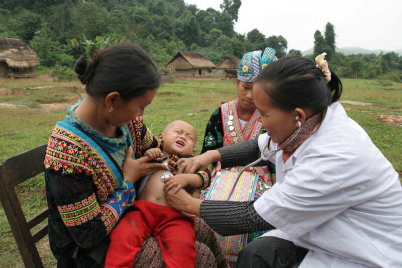 Doctor Visits Village in Laos — Doctor working for ADRA visits people in a remote, ethnic minority village in Laos — Laos, Doctor, health, checkup