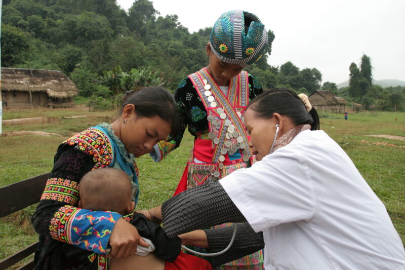 Doctor Visits Village in Laos — Doctor working for ADRA visits people in a remote, ethnic minority village in Laos — Laos, Doctor, health, checkup