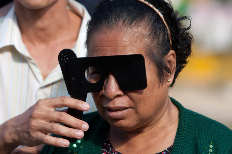 Eye Exam in Cambodia — Man gets a free Eye exam at a clinic in Cambodia supported by a volunteer group from the US — Cambodia, health, eye, eyes, exam