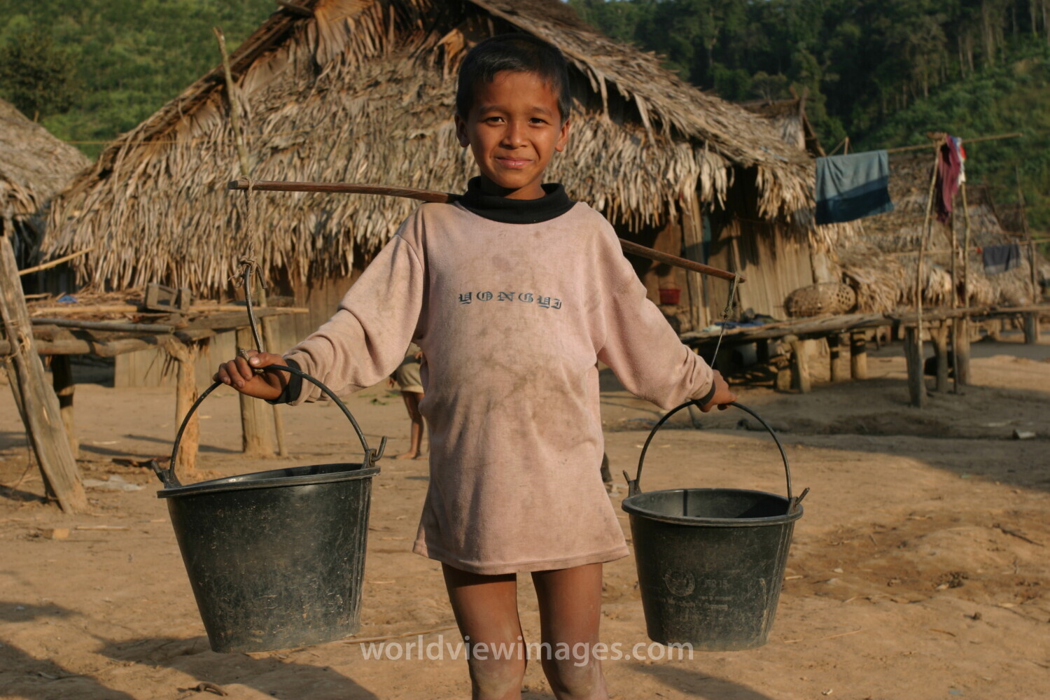 Boy with Water buckets in Laos