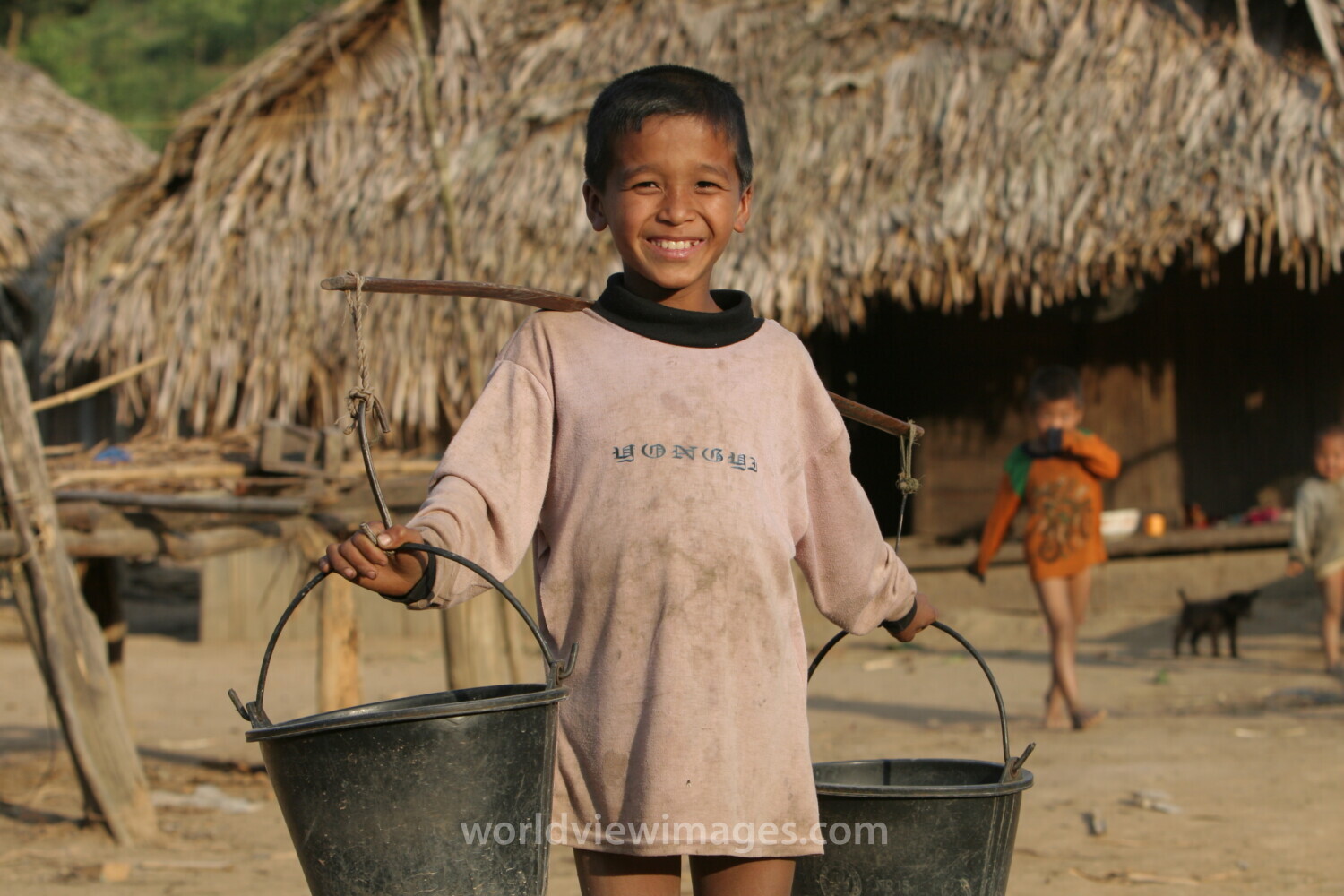 Boy with Water Buckets in Laos