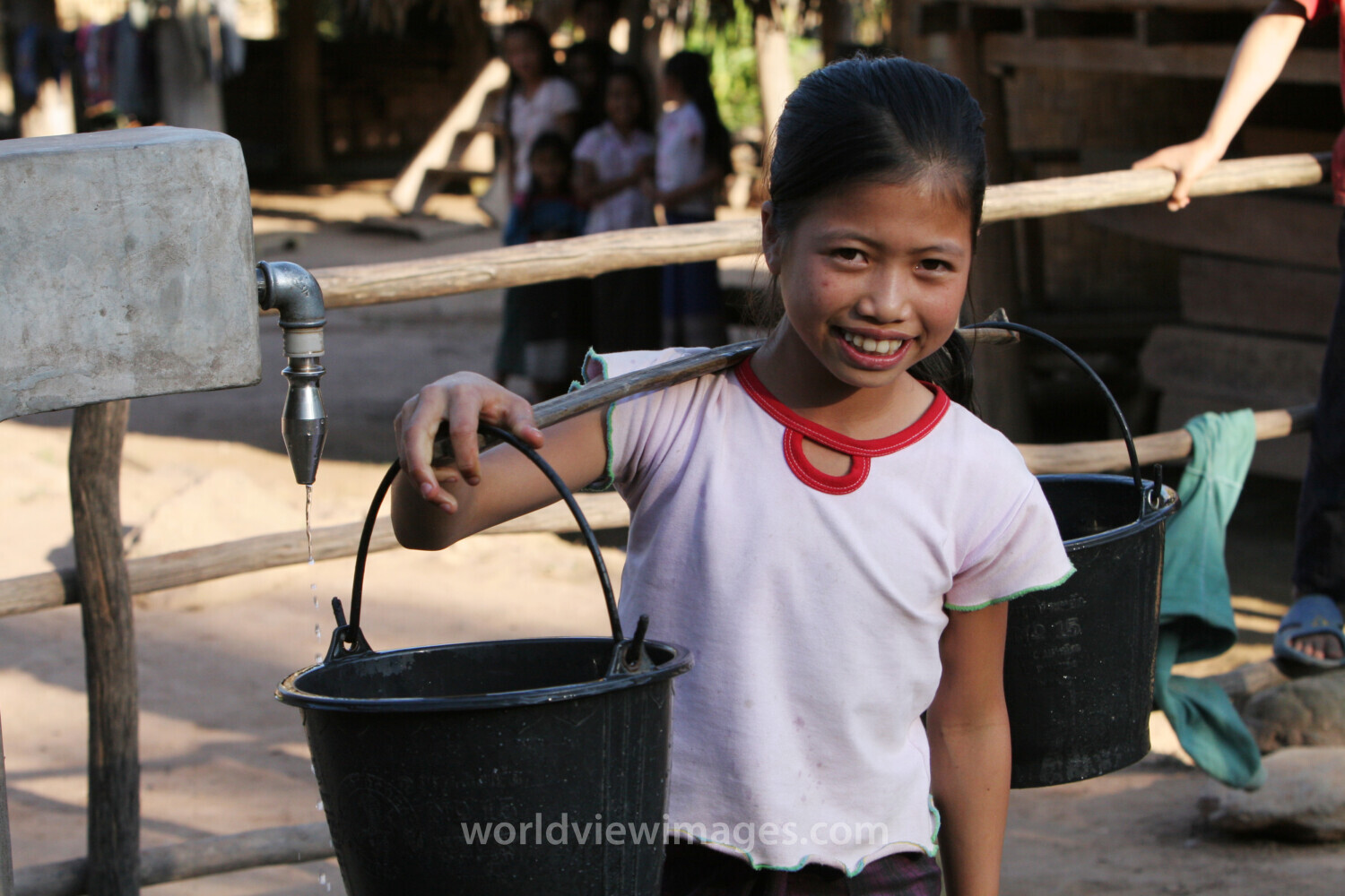 Girl at Water Tap in Laos