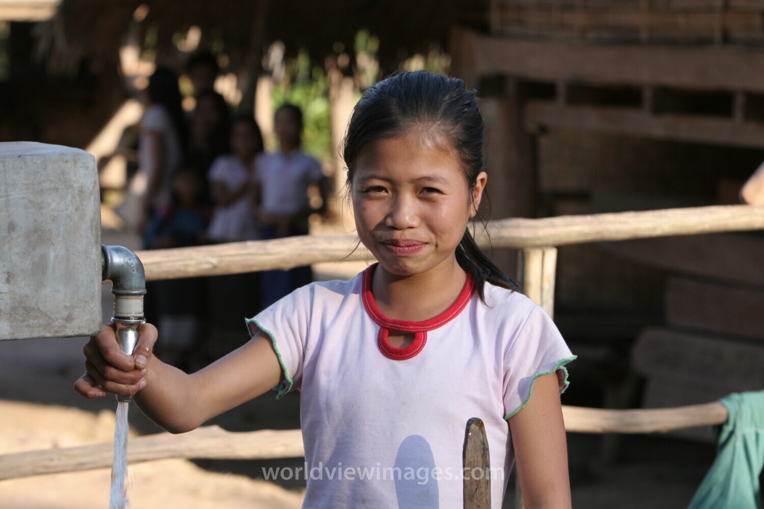 Girl at Water Tap in Laos