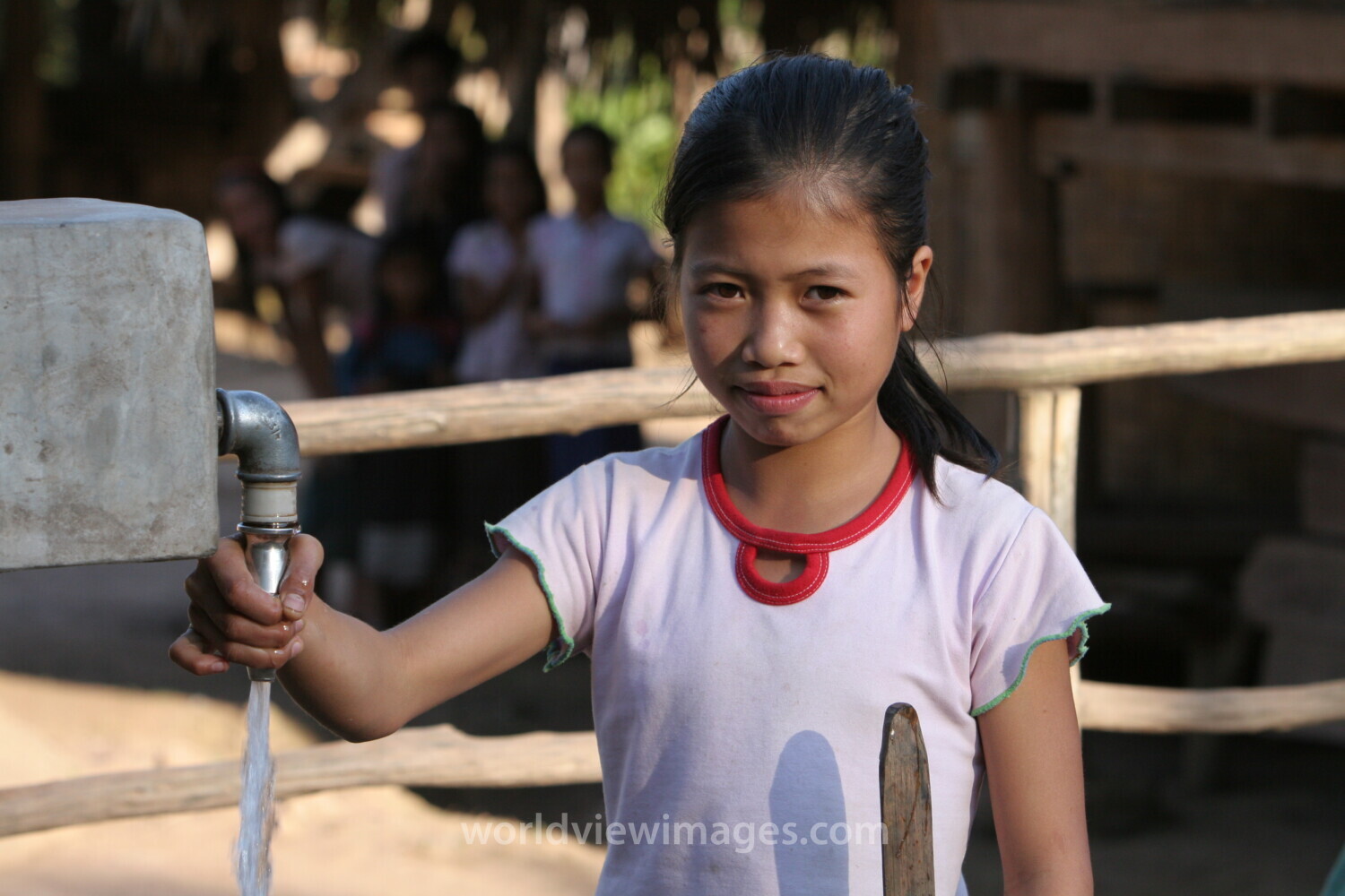 Girl at Water Tap in Laos