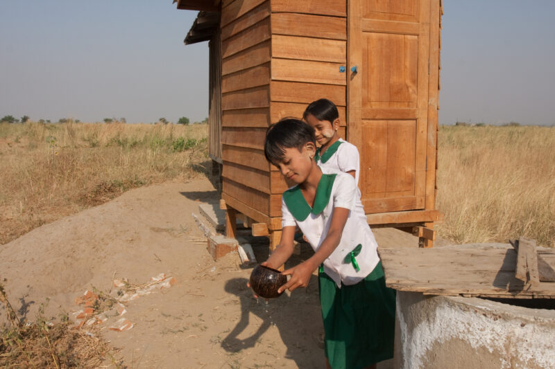 Toilets at School in Burma — Children run to use the new facilities, at their school, provided by a program on health and sanitation presented in their villa...