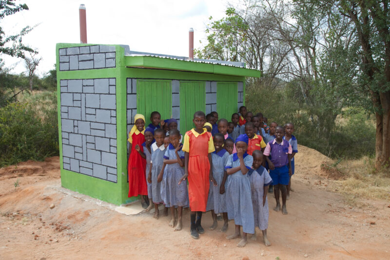 New Toilets in Kenya — Stock Image of students by the new toilets installed at their school by ADRA — Africa, Kenya, health, sanitation, latrines
