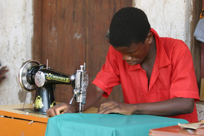 Learning to Sew in Malawi — Young man, orphaned by AIDS, benefits from an ADRA training program where he learns how to sew in Malawi — Malawi, Africa, ADRA, ...