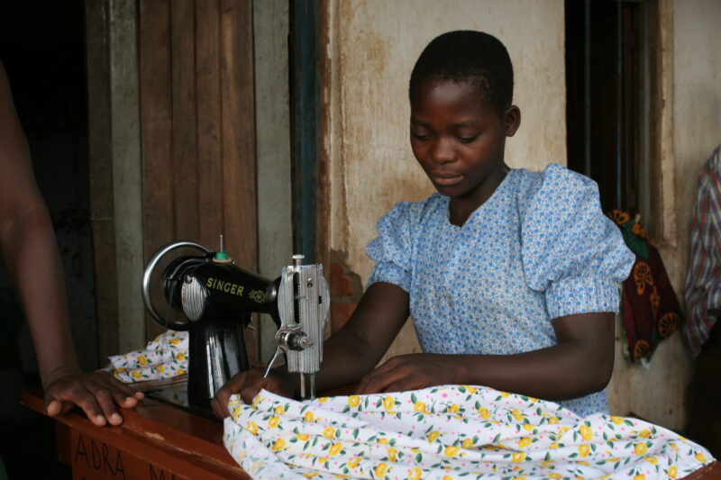 Learning How to Sew in Africa — Young people, orphaned by AIDS, benefit from an ADRA training program where they learns how to sew in Malawi — Malawi, Africa...
