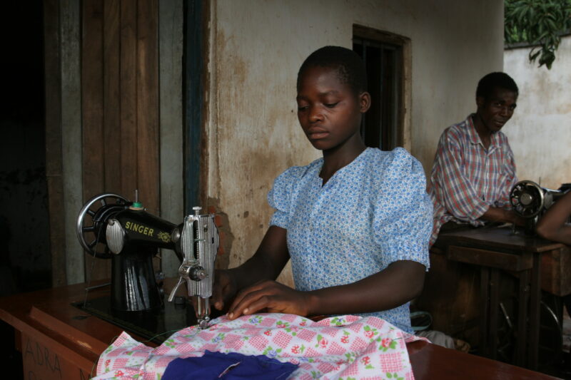 Learning How to Sew in Africa — Young people, orphaned by AIDS, benefit from an ADRA training program where they learns how to sew in Malawi — Malawi, Africa...