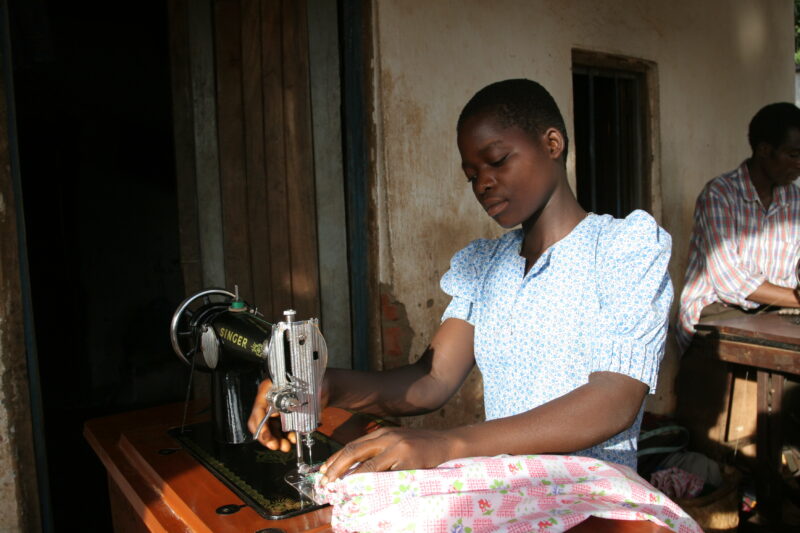 Learning How to Sew in Africa — Young people, orphaned by AIDS, benefit from an ADRA training program where they learns how to sew in Malawi — Malawi, Africa...
