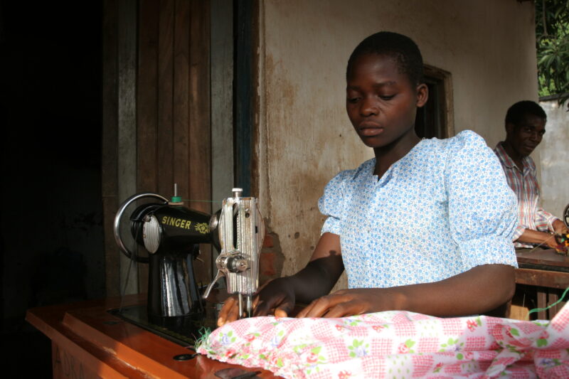 Learning How to Sew in Africa — Young people, orphaned by AIDS, benefit from an ADRA training program where they learns how to sew in Malawi — Malawi, Africa...