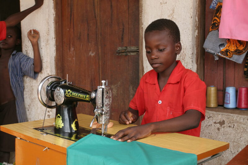 Learning How to Sew in Africa — Young people, orphaned by AIDS, benefit from an ADRA training program where they learns how to sew in Malawi — Malawi, Africa...