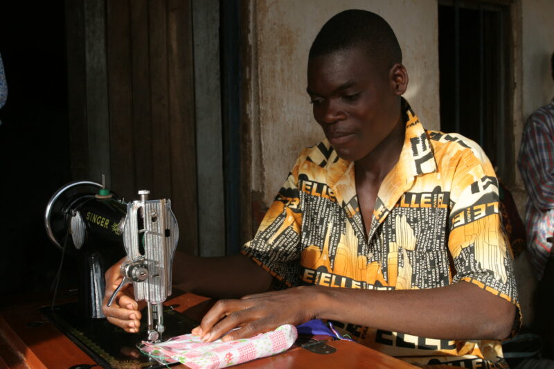 Learning How to Sew in Africa — Young people, orphaned by AIDS, benefit from an ADRA training program where they learns how to sew in Malawi — Malawi, Africa...