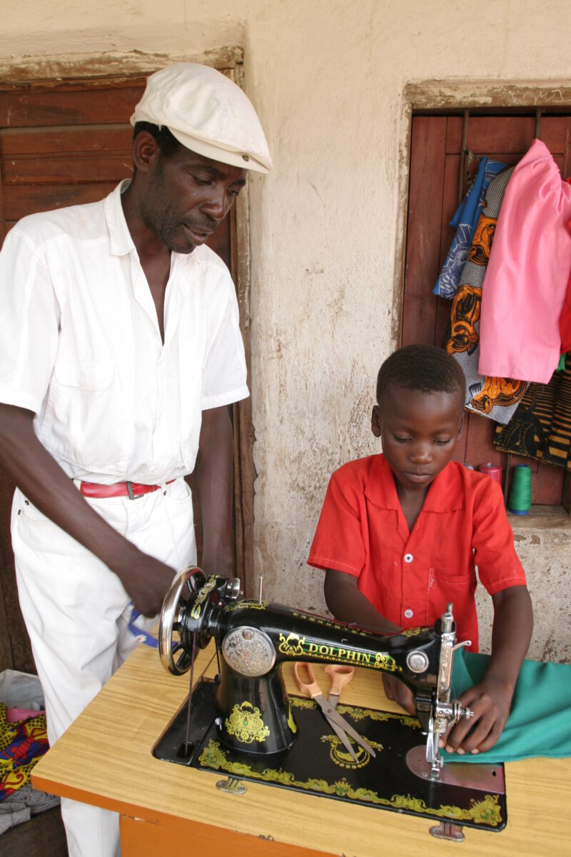 Learning to Sew in Malawi — Young man, orphaned by AIDS, benefits from an ADRA training program where he learns how to sew in Malawi — Malawi, Africa, ADRA, ...