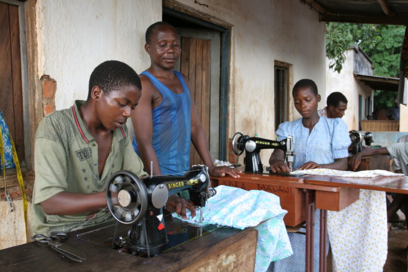 Learning How to Sew in Africa — Young people, orphaned by AIDS, benefit from an ADRA training program where they learns how to sew in Malawi — Malawi, Africa...
