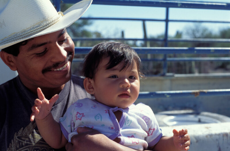 Man in Mexico — Proud Dad in Mexico, shows off his Baby — Rural, men, man, faces, poor