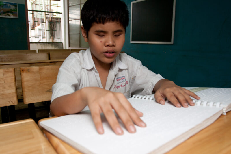 Vision Impared in Vietnam — Stock Image of child with vision impairment at a school for the blind in Vietnam. — Vietnam, children, child, children with disab...