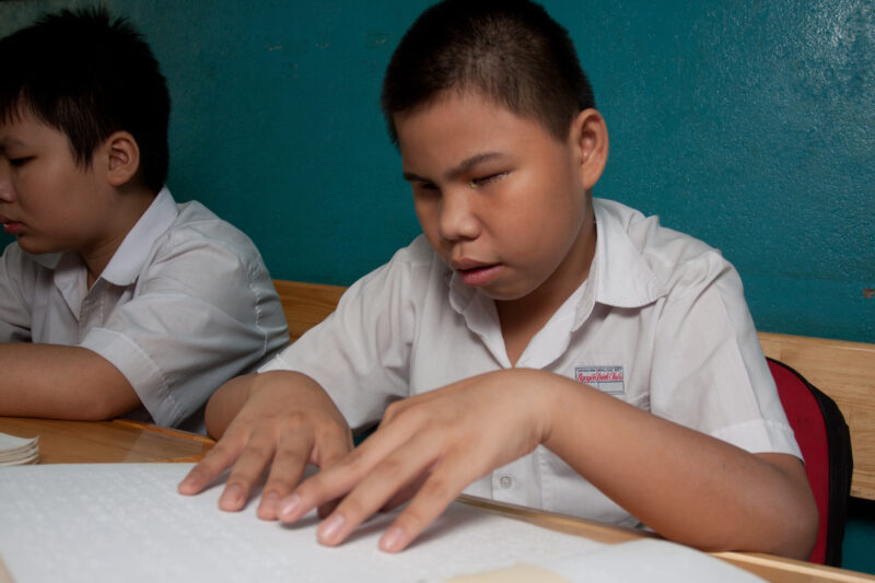Vision Impared in Vietnam — Stock Image of child with vision impairment at a school for the blind in Vietnam. — Vietnam, children, child, children with disab...