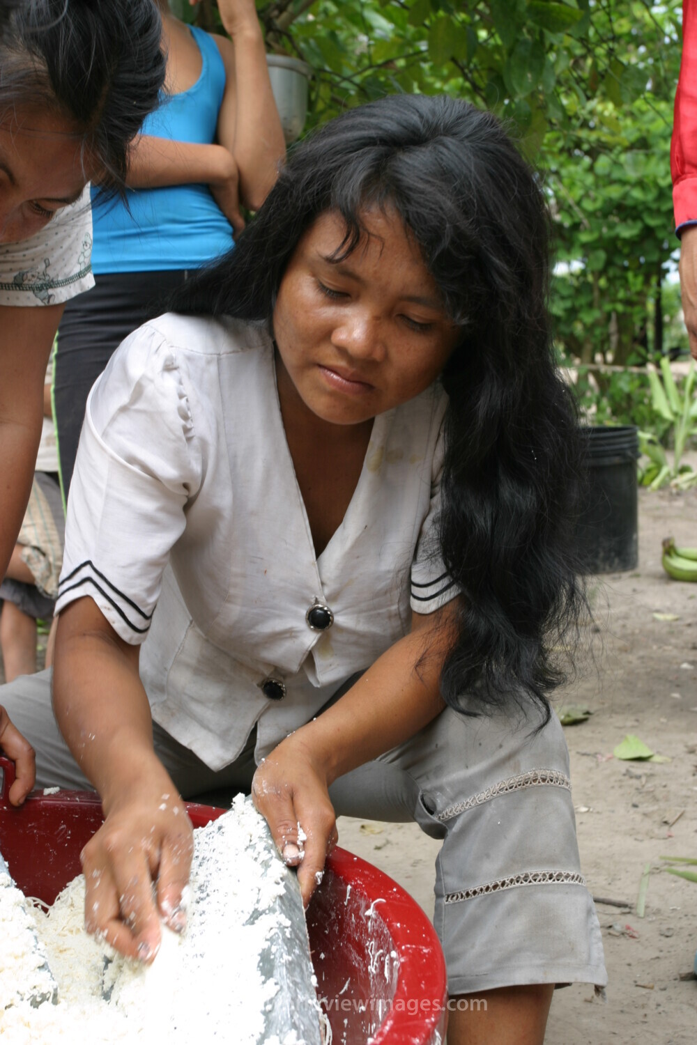 Woman Shreds Cassava in Peru