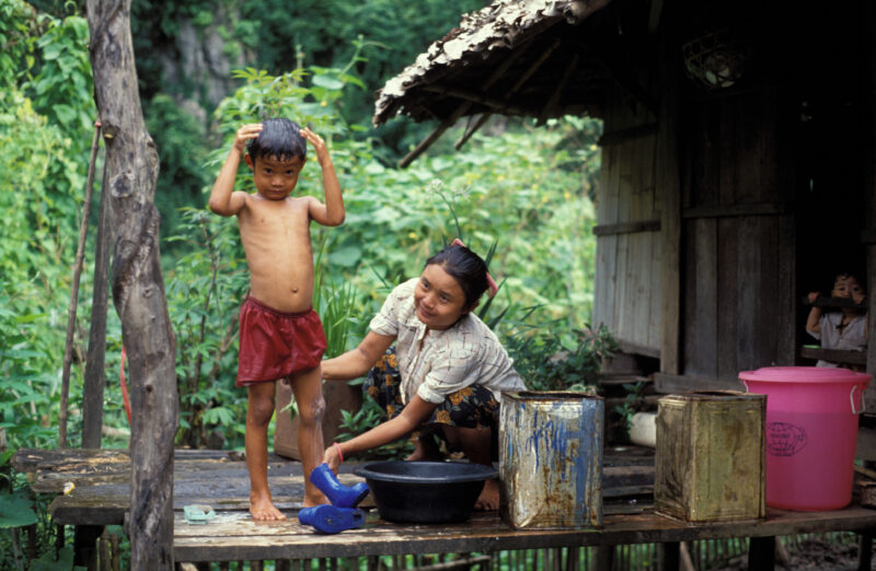 Washing Up in A Refugee Camp — Karen boy in a refugee camp in Thailand gets a bath. — Karen, refugee Camp, Thailand, water, washing