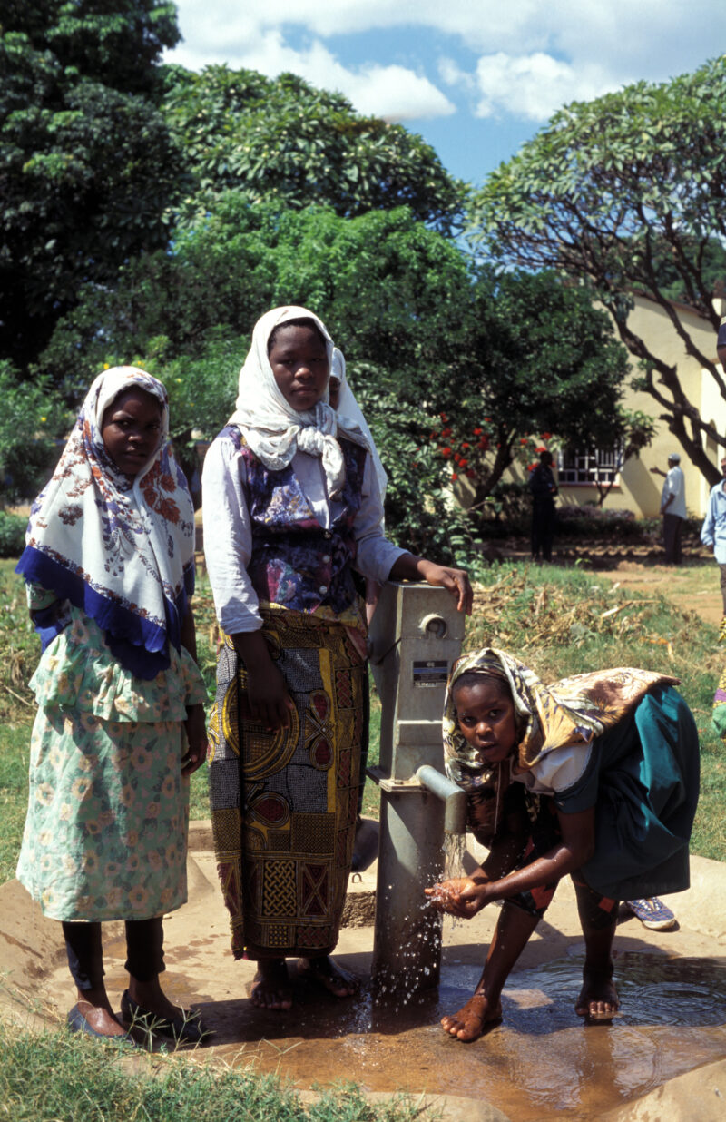 Washing Up for Prayer — Muslims wash up before going to mosque, at a ADRA well installed on the grounds of their Mosque — Africa, Malawi, well, water, washing