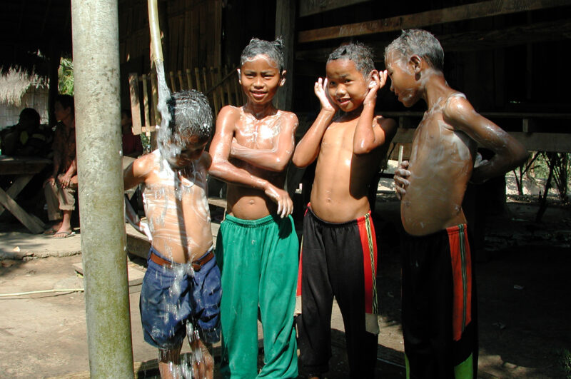 Washing Up in Thailand — Washing up under a tap fed by a gravity fed system to ethnic villages in Thailand with help from ADRA — Thailand, water, tap, gravit...