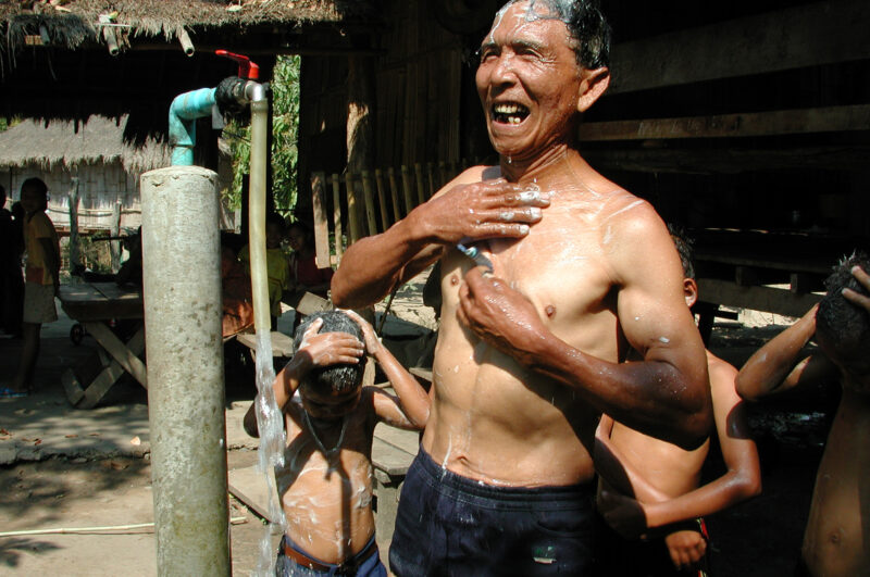 Washing Up in Thailand — Washing up under a tap fed by a gravity fed system to ethnic villages in Thailand with help from ADRA — Thailand, water, tap, gravit...