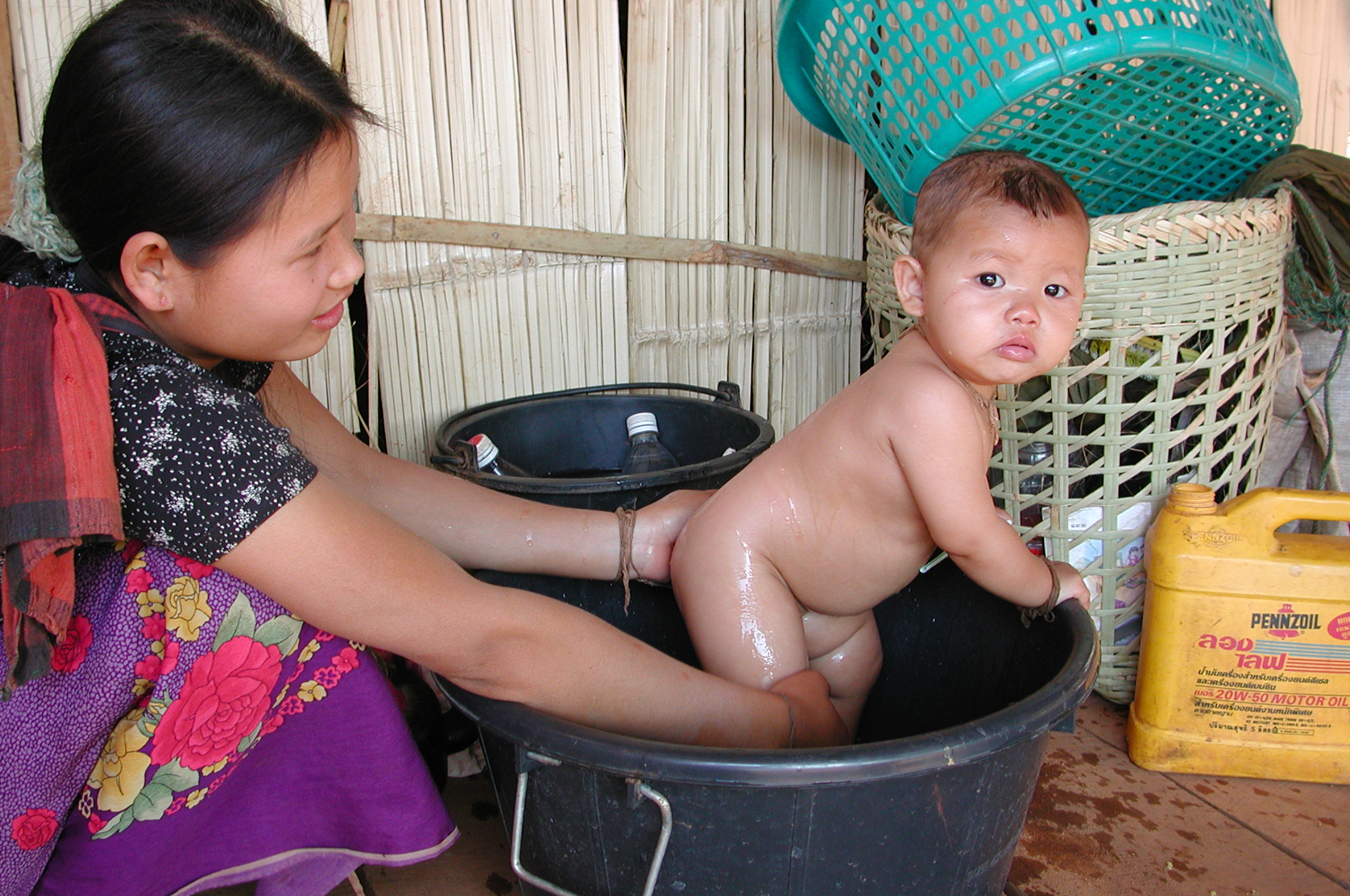 Bathing baby in Thailand