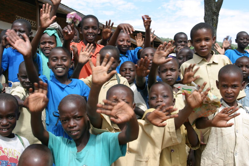 Happy Students — Happy Children in Rwanda wave outside their new school in Rwanda — Rwanda, Africa, ADRA, Poverty, Development