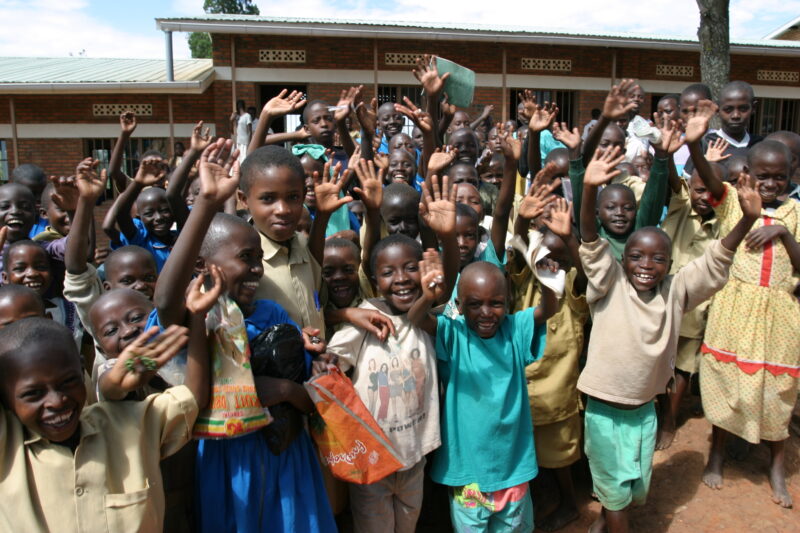 Happy Students — Happy Children in Rwanda wave outside their new school in Rwanda — Rwanda, Africa, ADRA, Poverty, Development