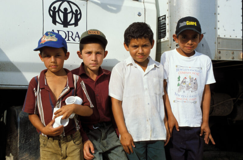 Boys in Honduras — Children pose in front of an ADRA truck, delivering supples to internally displaced people in Honduras. — Honduras, boys, children, ADRA