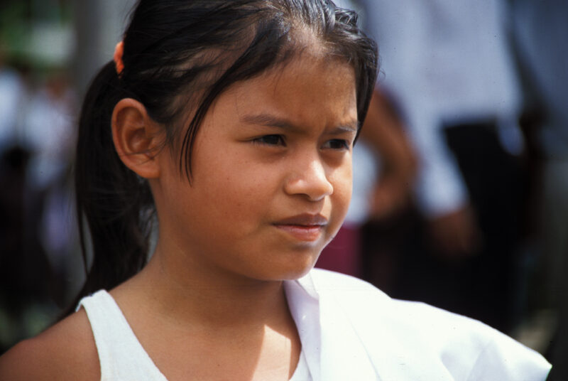 Internally Displaced in Honduras — Children from a village in Honduras that was wiped out by mudslides sit in front of their new homes build by ADRA — Hondur...