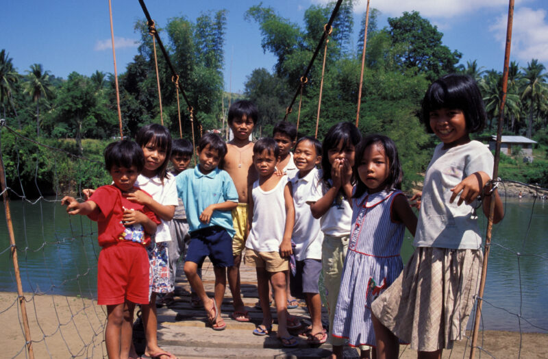Group of Children in the Philippines — A group of children pose on a bridge that ADRA built in their village to help them get to school. — Philippines, child...