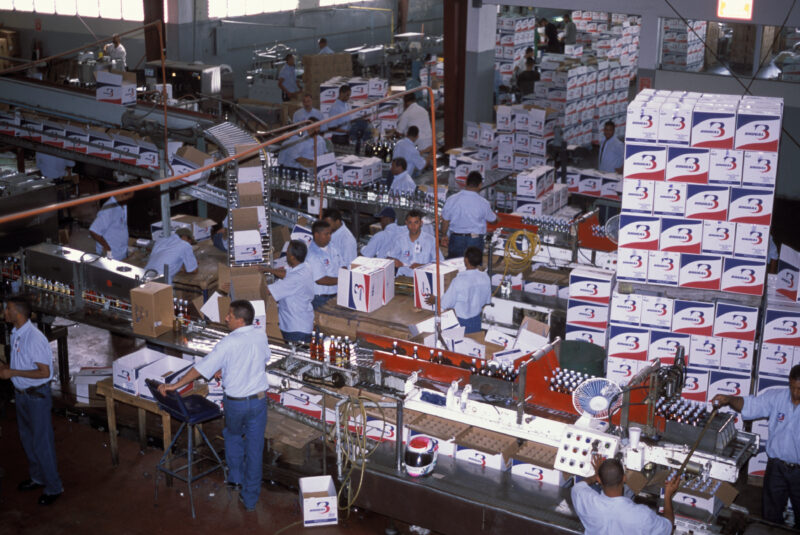 Rum Bottling in Dominican Republic — Men working at a Rum bottling factory in Peurto Plata — Dominican Republic, Peurto Plata, Rum, Rum Factory, Bottlers