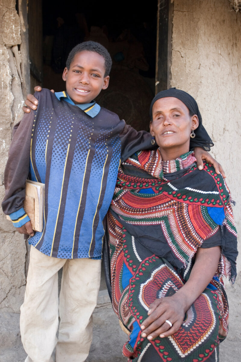 Mother and boy in Ethiopia — Stock image of a mother with a disabled son, by the doorway to their home. — Ethiopia, Africa, African, Africans, Ethiopian