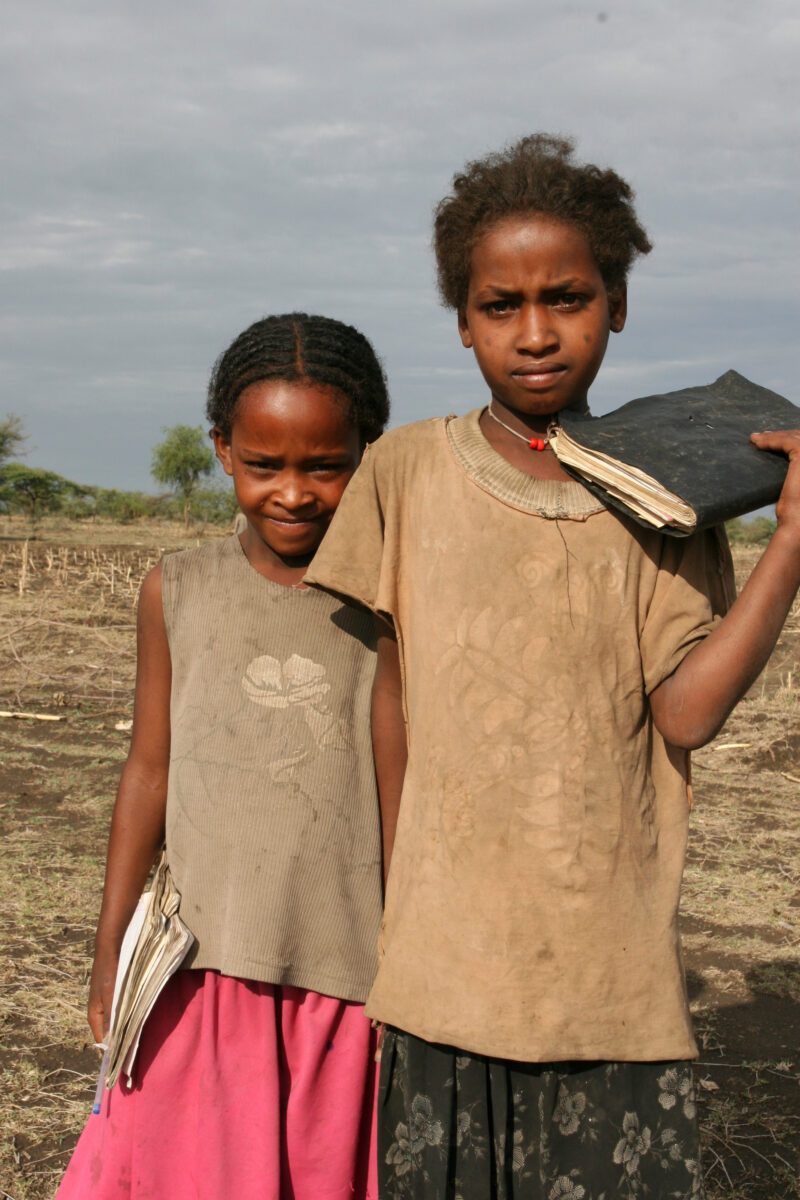 School Girls in Ethiopia — Children in a poor village in Ethiopia, walk to their new school, provided by ADRA. — Ethiopia, Africa, African, Africans, Ethiopian