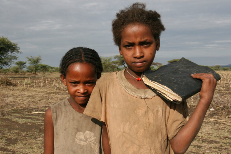 School Girls in Ethiopia — Children in a poor village in Ethiopia, walk to their new school, provided by ADRA. — Ethiopia, Africa, African, Africans, Ethiopian