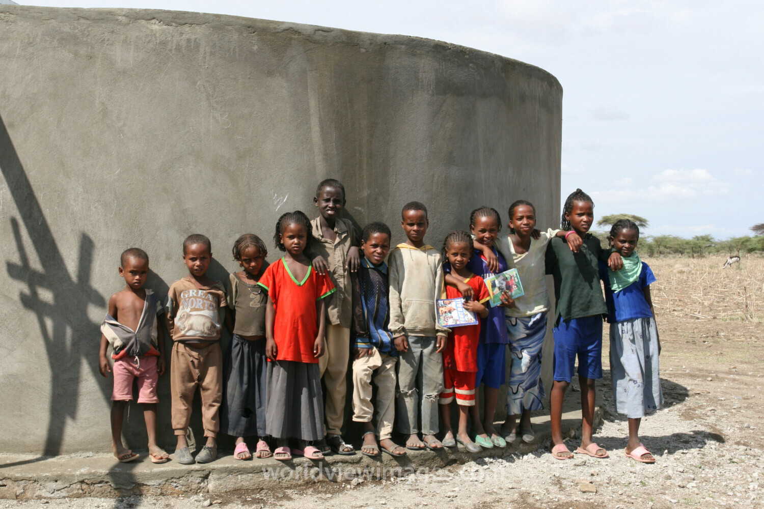 Students by Water Tank in Ethiopia