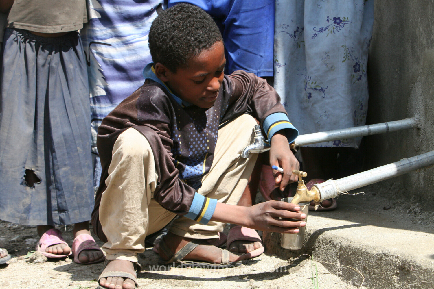 Boy Gets Drink at School