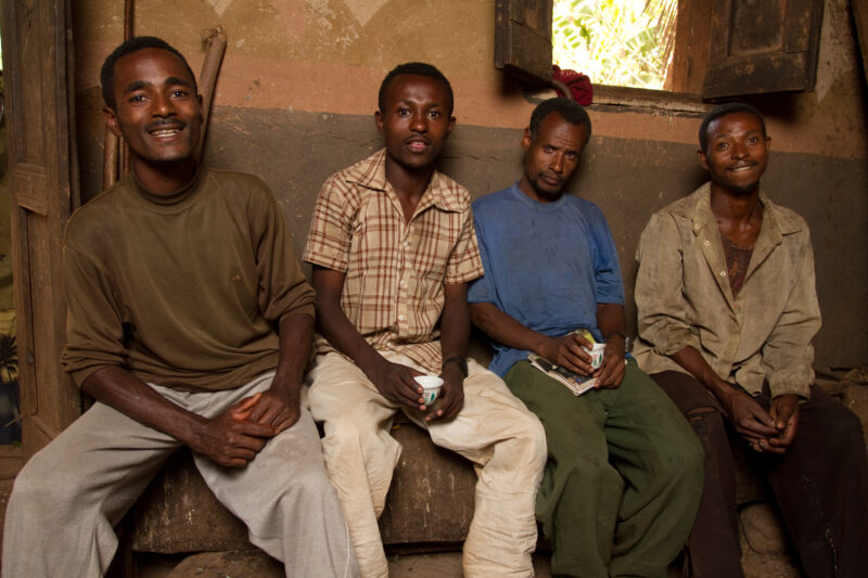 Young Men in Ethiopia — Stock Image of young farmers stopping for coffee at a friends house in Ethiopia — Ethiopia, Africa, African, Africans, Ethiopian