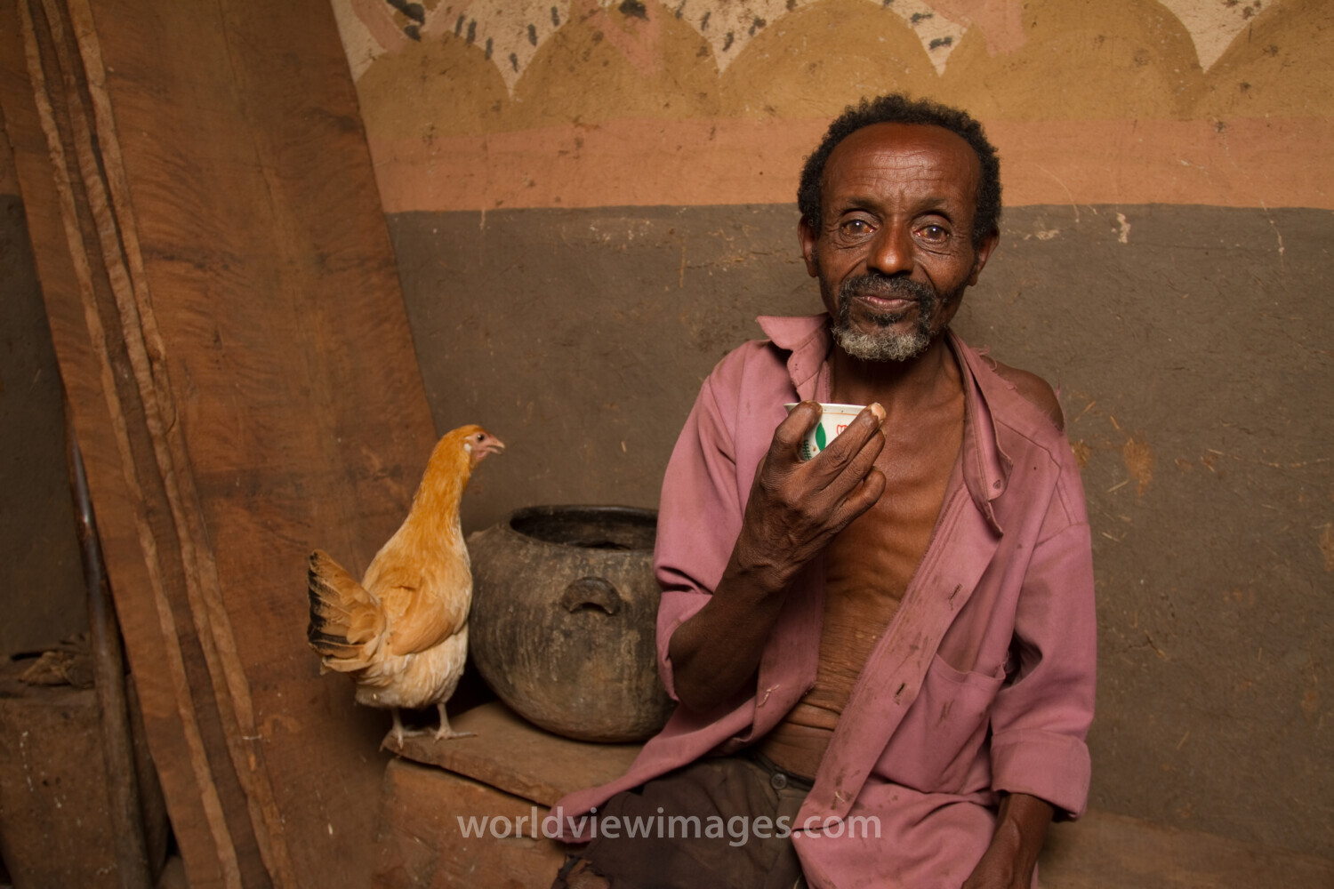 Farmer in Ethiopia Sips Coffee