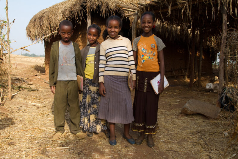 Ready for School in Ethiopia — Children ready to go to school stand outside their home in Rural Ethiopia — Ethiopia, Africa, African, Africans, Ethiopian