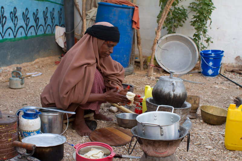 A Time of Drought in Somolia — Cooking a meal with Flour from a food distribution for IDPs — Somolia, drought, IDP, Internally Displaced