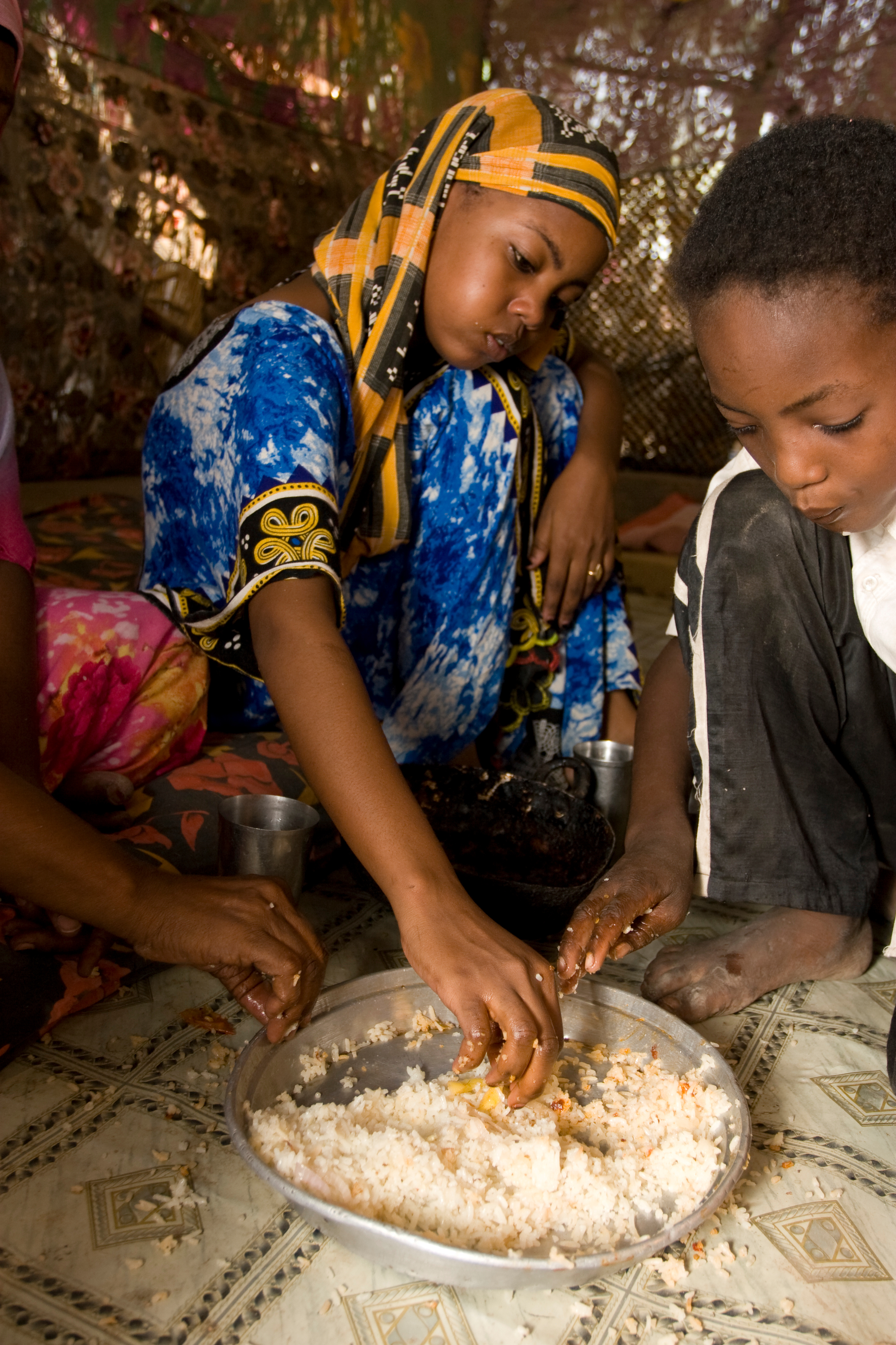Sharing a Meal in a Refugee Camp