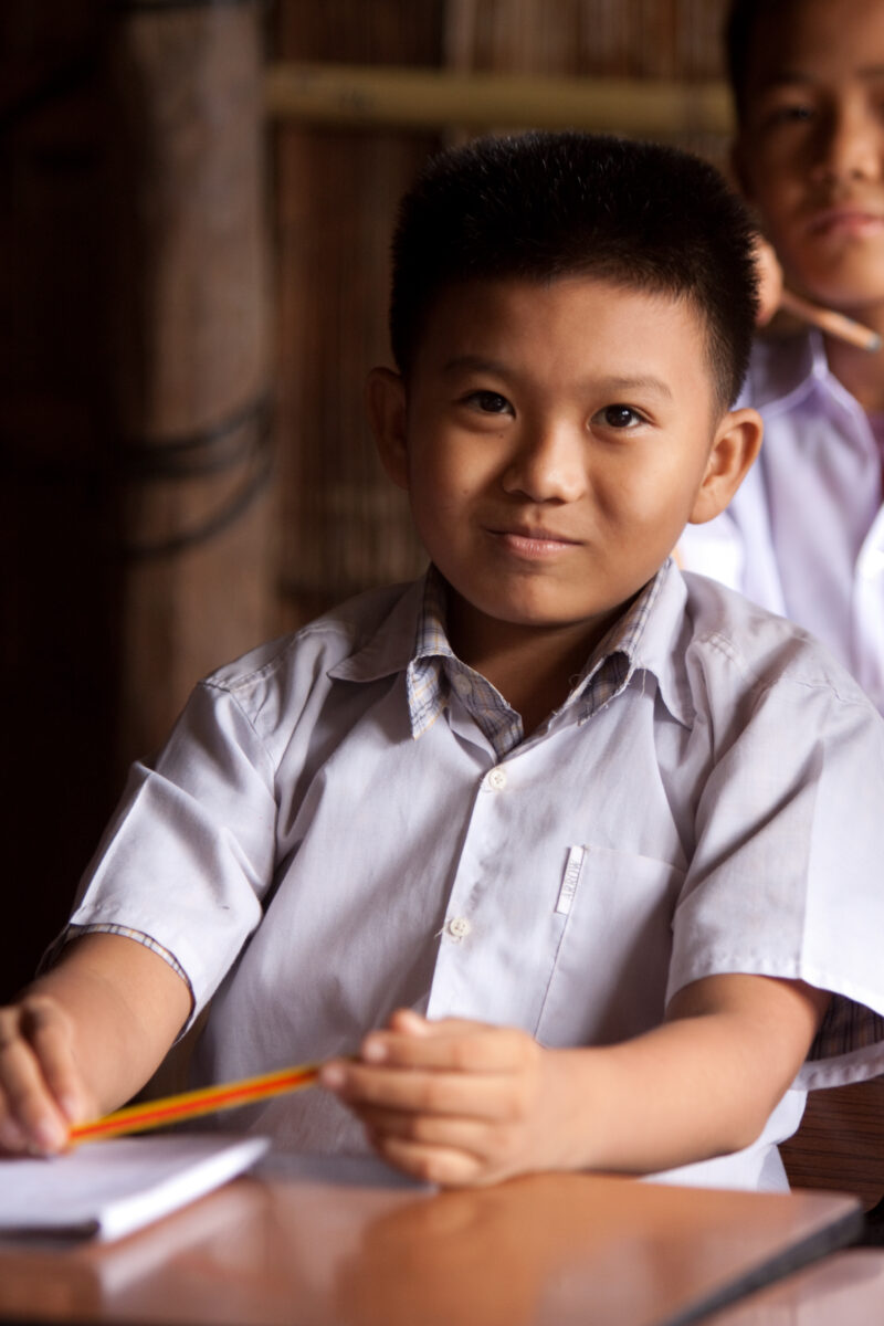 Student in a Refugee Camp — Karen people from Myanmar (Burma) have spent years in in refugee camps along the Thai/Burma border, to avoid violence from the mi...