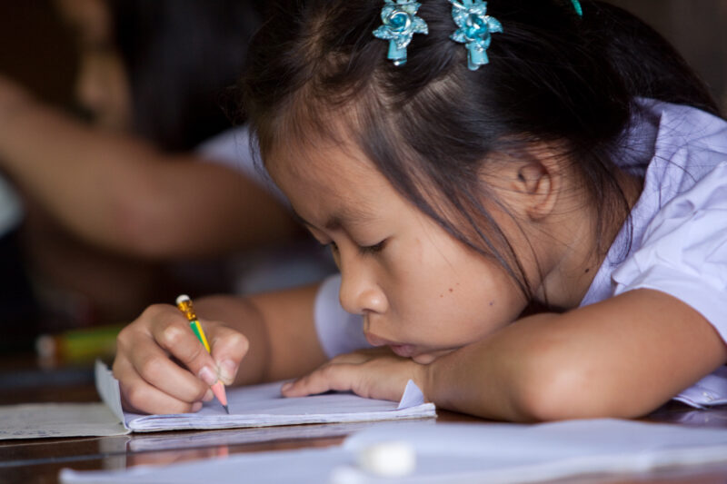 Student in a Refugee Camp — Karen people from Myanmar (Burma) have spent years in in refugee camps along the Thai/Burma border, to avoid violence from the mi...