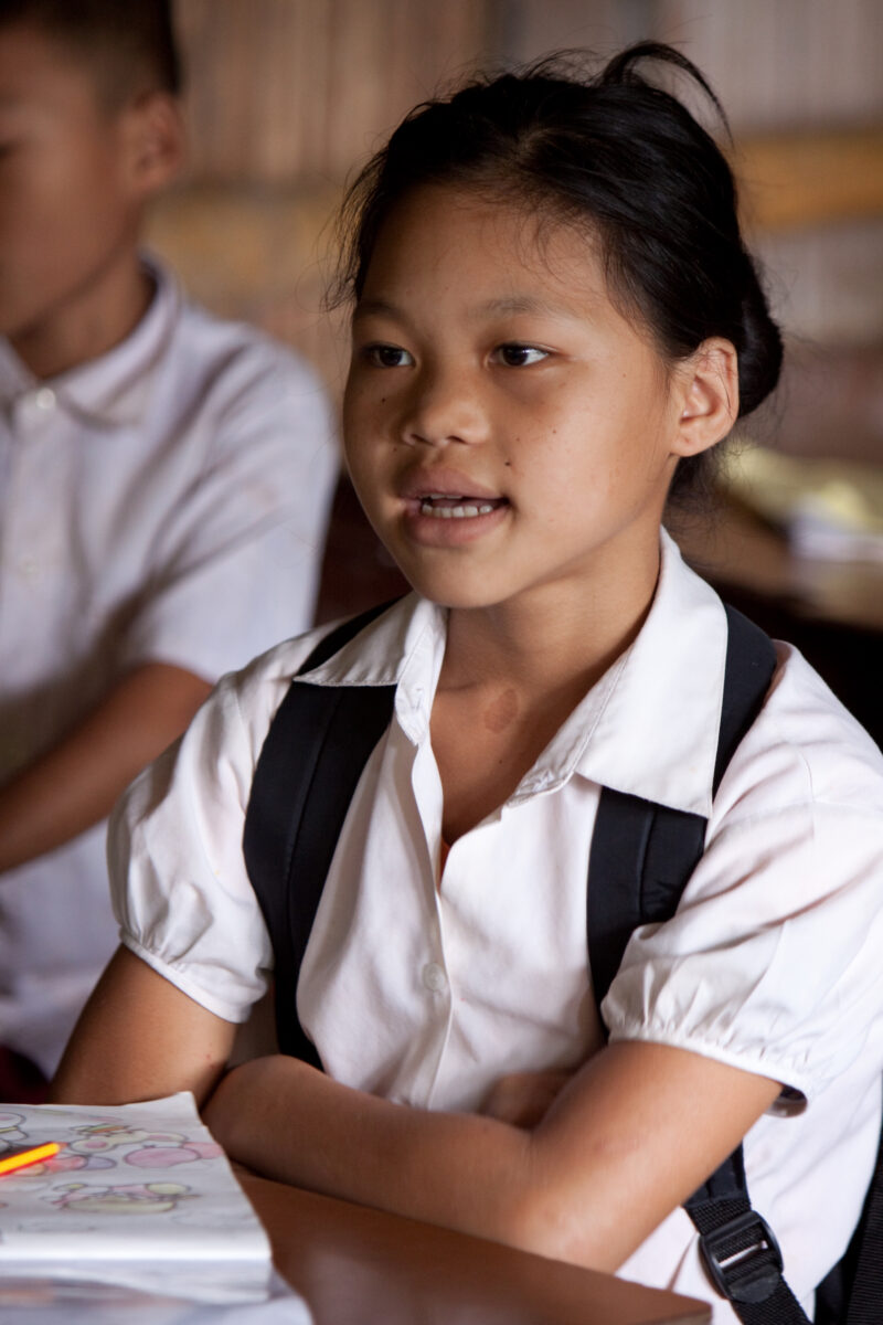 Student in a Refugee Camp — Karen people from Myanmar (Burma) have spent years in in refugee camps along the Thai/Burma border, to avoid violence from the mi...