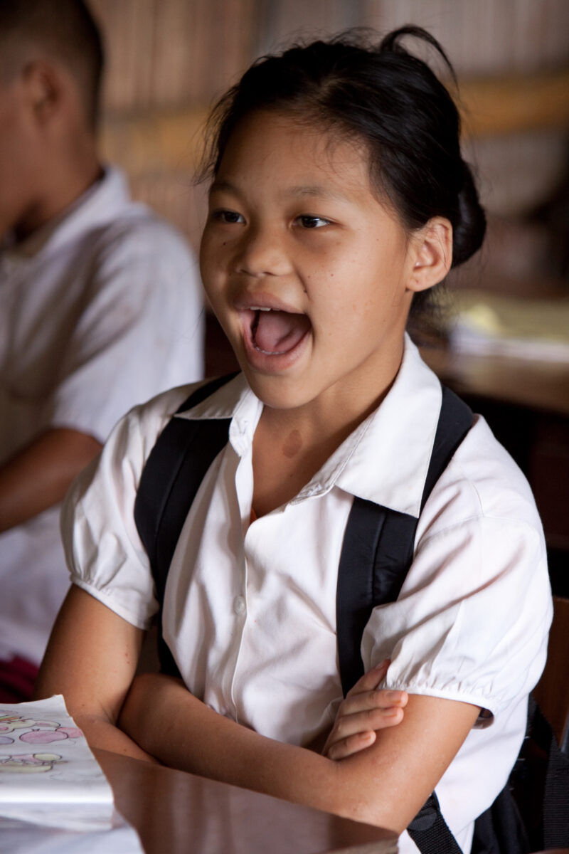 Student in a Refugee Camp — Karen people from Myanmar (Burma) have spent years in in refugee camps along the Thai/Burma border, to avoid violence from the mi...