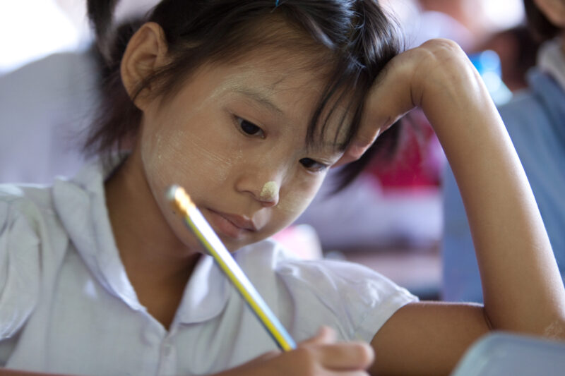 Student in a Refugee Camp — Karen people from Myanmar (Burma) have spent years in in refugee camps along the Thai/Burma border, to avoid violence from the mi...